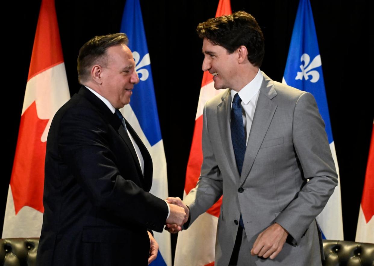 Prime Minister Justin Trudeau, right, and Quebec Premier Francois Legault shake hands as they meet, in Quebec City, Monday, June 10, 2024. THE CANADIAN PRESS/Jacques Boissinot