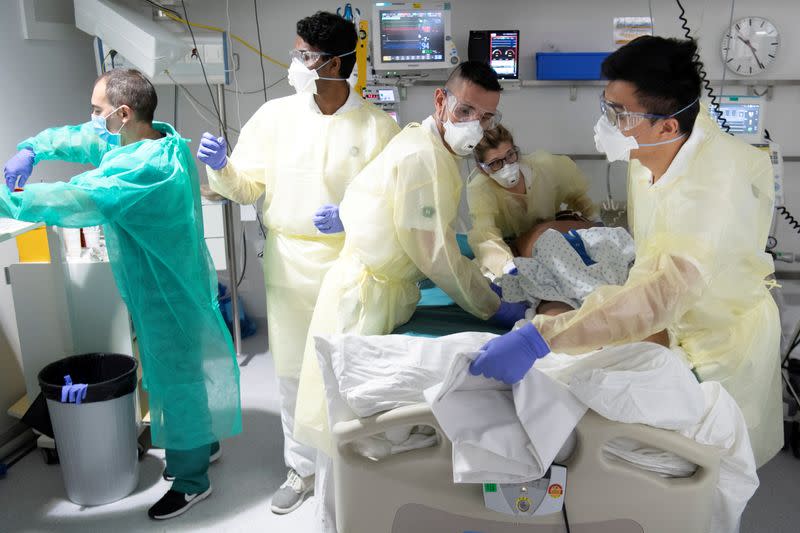 FILE PHOTO: Staff treat a patient in the intensive care unit at the CHUV in Lausanne