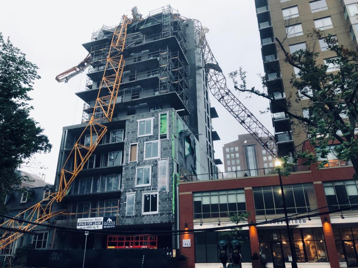 A crane owned and operated by Lead Structural Formwork of Moncton, N.B., collapsed during post-tropical storm Dorian on Sept. 7, 2019, onto a building that was under construction. No one was injured in the collapse. (Craig Paisley/CBC - image credit)