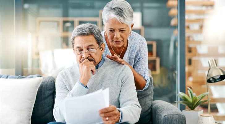 A retired couple looks over their options for paying for long-term care.