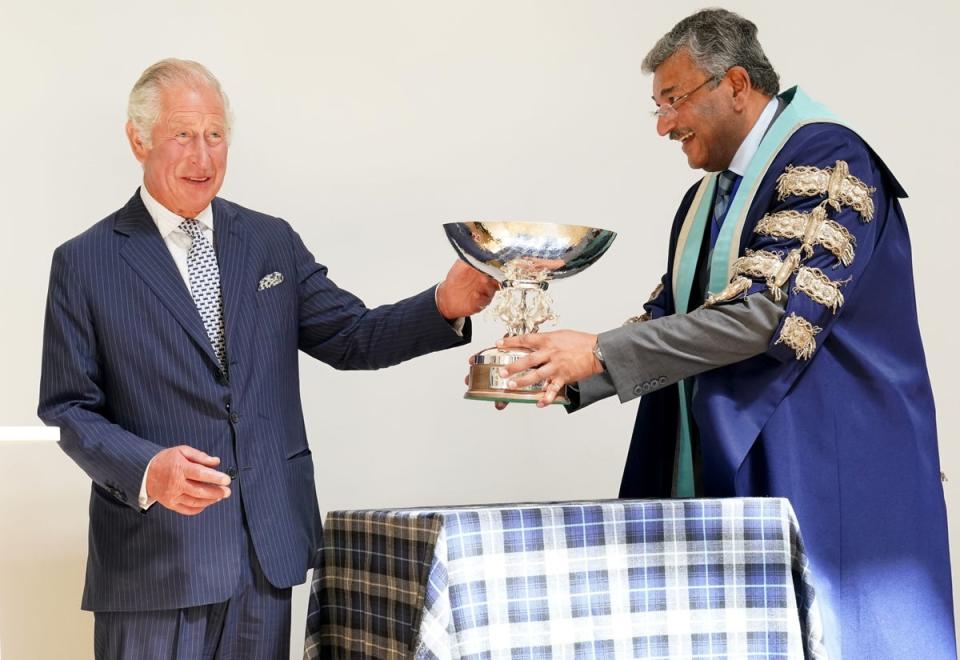 Charles is presented with a commemorative bowl during his visit (Jane Barlow/PA) (PA Wire)