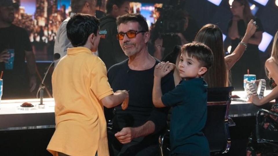 Simon Cowell with two young boys
