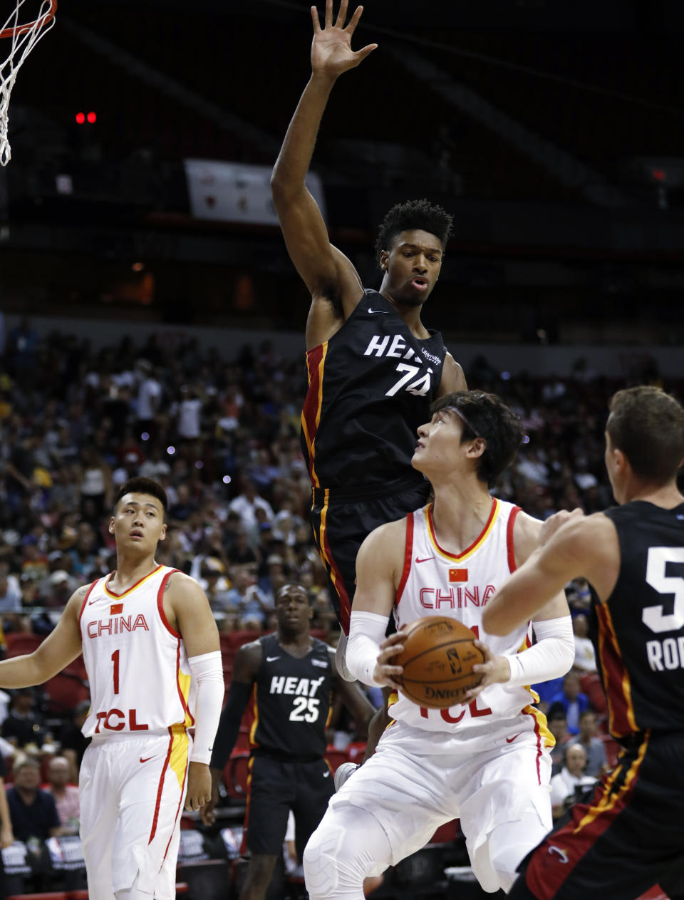 Miami Heat's Kyle Alexander (74) jumps to block a shot by China's Wang Zhelin (31) as China's Zhao Rui (1) watches during an NBA summer league basketball game Friday, July 5, 2019, in Las Vegas. (AP Photo/Steve Marcus)