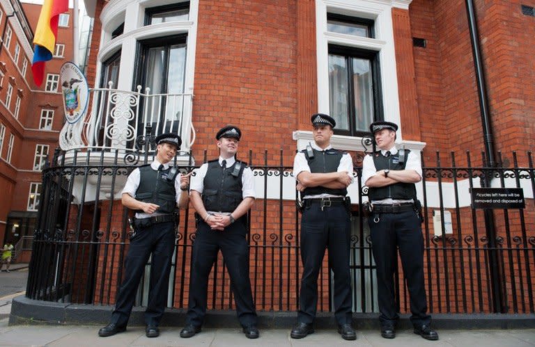 Police stand outside the Ecuadorian Embassy in London on August 19, 2012. A hidden microphone was found in Ecuador's embassy in London, where WikiLeaks founder Julian Assange is holed up, Ecuador's foreign minister said