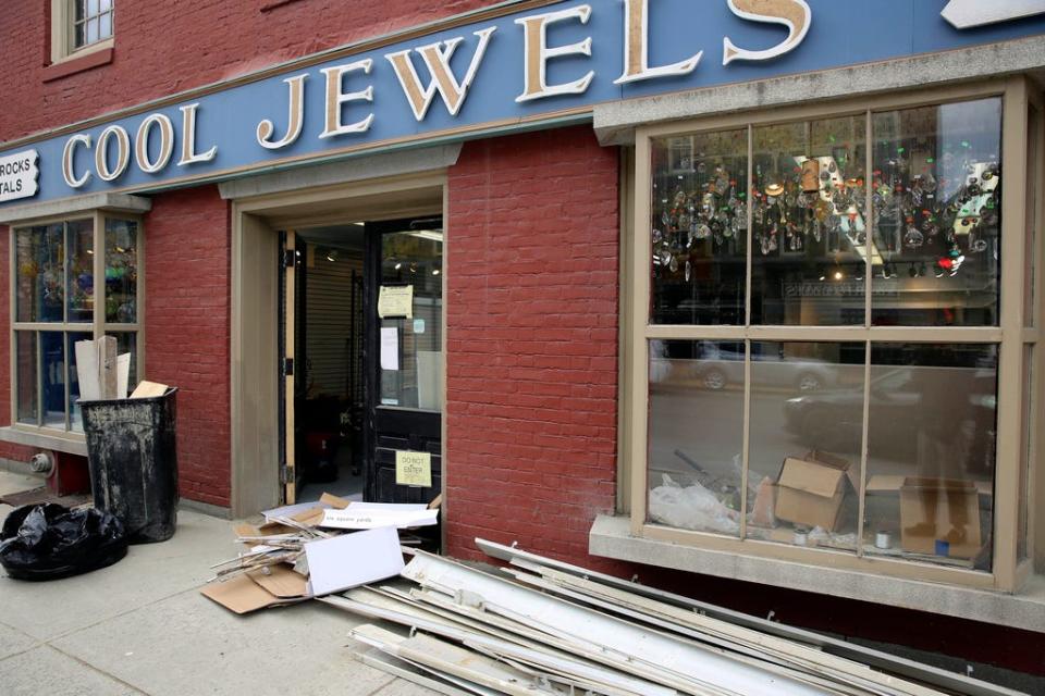 Building supplies sit on the sidewalk outside of the Cool Jewels store in Montpelier, Vt. on Friday, Oct. 6, 2023. Three months after severe flooding inundated the small city, Montpelier is holding a reopening celebration Friday and Saturday to show the recovery progress.