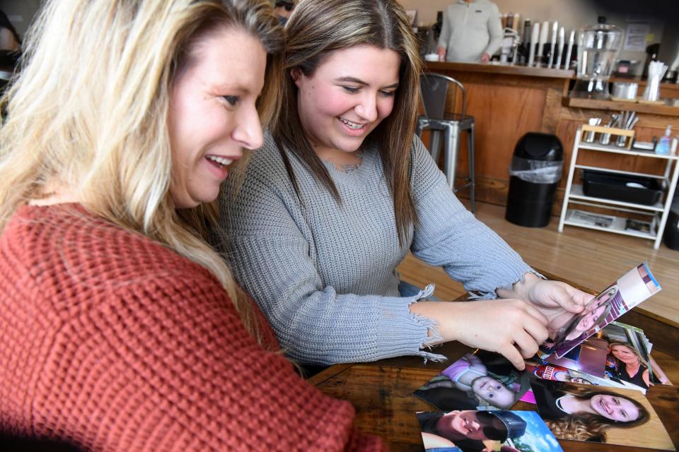 Jodi Kuipers and her daughter, Lauryn Kuipers, reminisce while looking through old family photos of JodiÕs twin sister, Jennifer Torgerson, and 12-year-old niece, Kaylee Torgerson, on Friday, February 3, 2023, in Sioux Falls. Jennifer and Kaylee died after the pickup truck they were riding in collided with a train. 