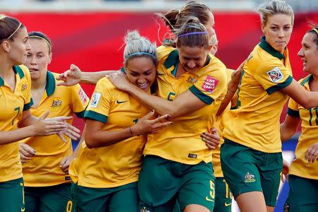 Jun 12, 2015; Winnipeg, Manitoba, CAN; Australia forward Kyah Simon (17) is congratulated by defender Laura Alleway (5) after scoring against Nigeria during the second half in a Group D soccer match in the 2015 FIFA women's World Cup at Winnipeg Stadium. Michael Chow-USA TODAY Sports