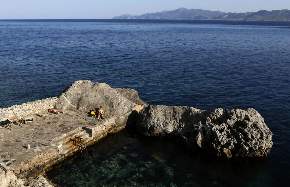 Foreign tourists are seen in a small bay in the town of Monemvasia Yannis Behrakis / Reuters