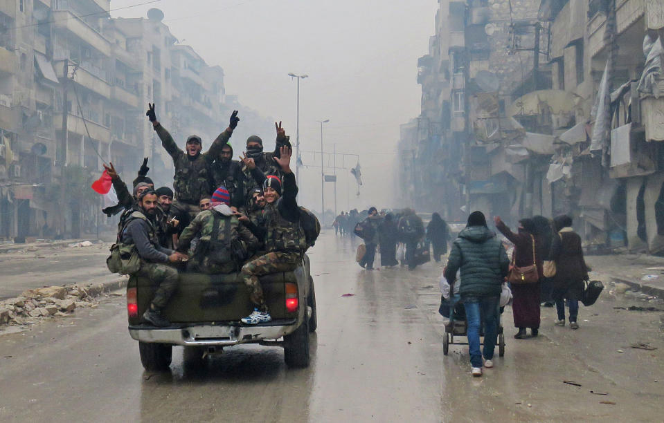 Syria regime troops celebrate Aleppo victory; executions reported