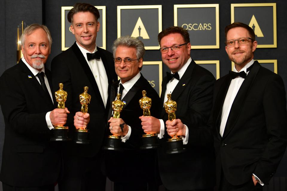 Dune sound team Doug Hemphill, Theo Green, Mark Mangini, Ron Barlett, and Mac Ruth in the press room during the 94th Oscars at the Dolby Theatre in Hollywood, California on March 27, 2022. (Photo by Frederic J. Brown / AFP) (Photo by FREDERIC J. BROWN/AFP via Getty Images)