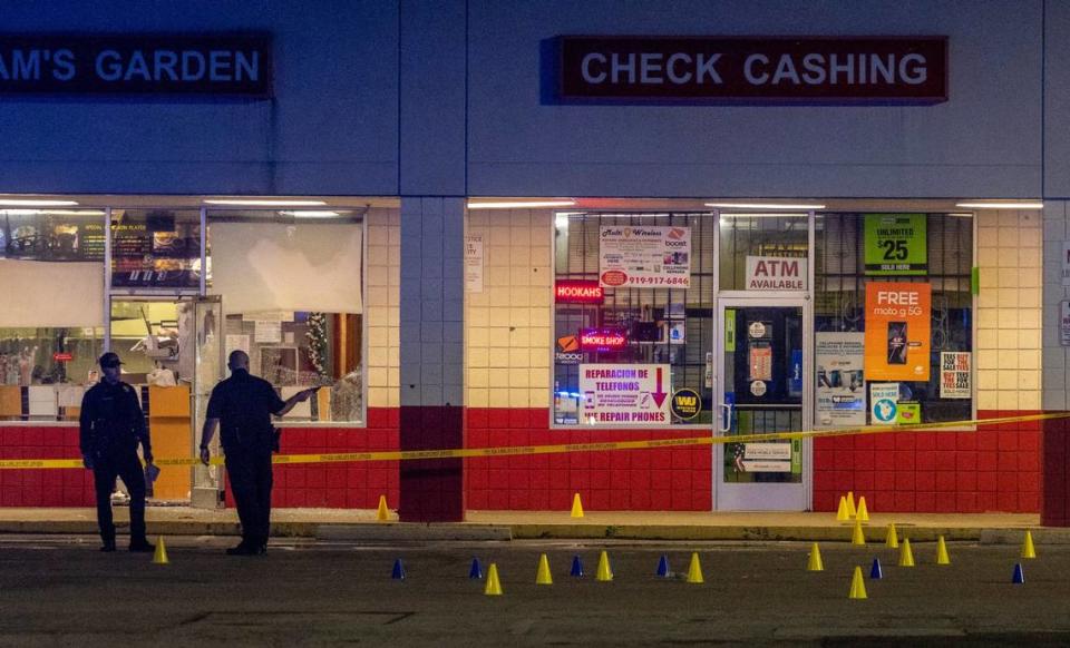 Police investigate the scene of a shooting at the Raleigh Boulevard Shopping Center Monday night, March 27, 2023.