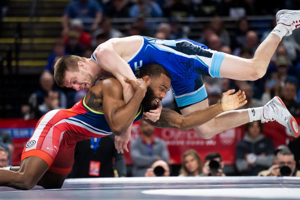 Jason Nolf (top) wrestles Jordan Burroughs in the 74 kilogram challenge round championship bout during the U.S. Olympic Team Trials at the Bryce Jordan Center April 19, 2024, in State College. Nolf won by decision, 3-0.