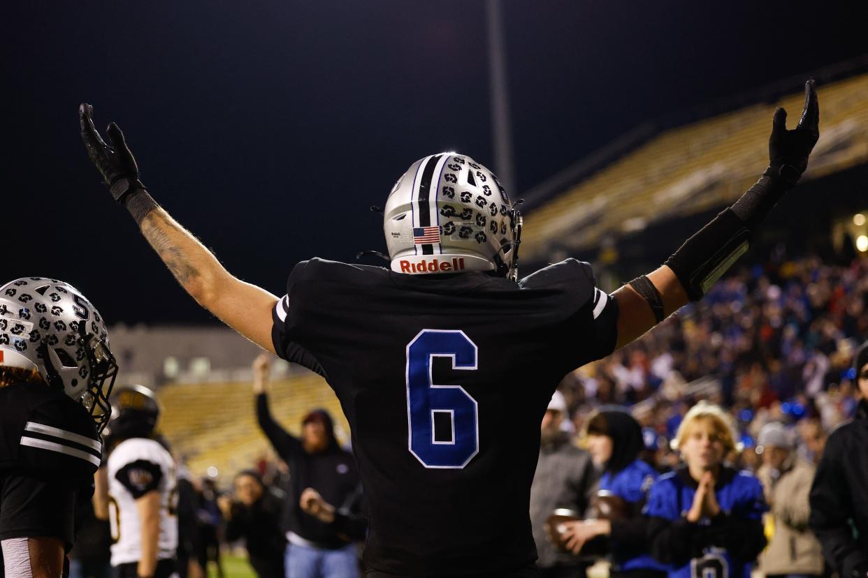 Hilliard Bradley’s Preston Wolfe celebrates a touchdown during a 35-28, double-overtime win over Upper Arlington on Friday.