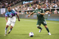 Portland Timbers midfielder Sebastián Blanco reaches for the ball against Minnesota United during an MLS soccer match at Providence Park in Portland, Ore. on Saturday, May 20, 2023. (Vickie Connor/The Oregonian via AP)