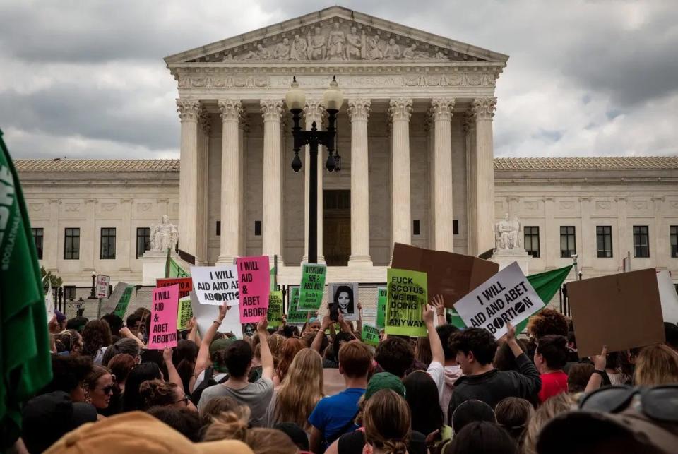 Abortion rights demonstrators protest outside the U.S. Supreme Court on June 24 after it overturned the landmark Roe v. Wade abortion decision. A Texas law banning almost all abortions will now take effect Aug. 25.