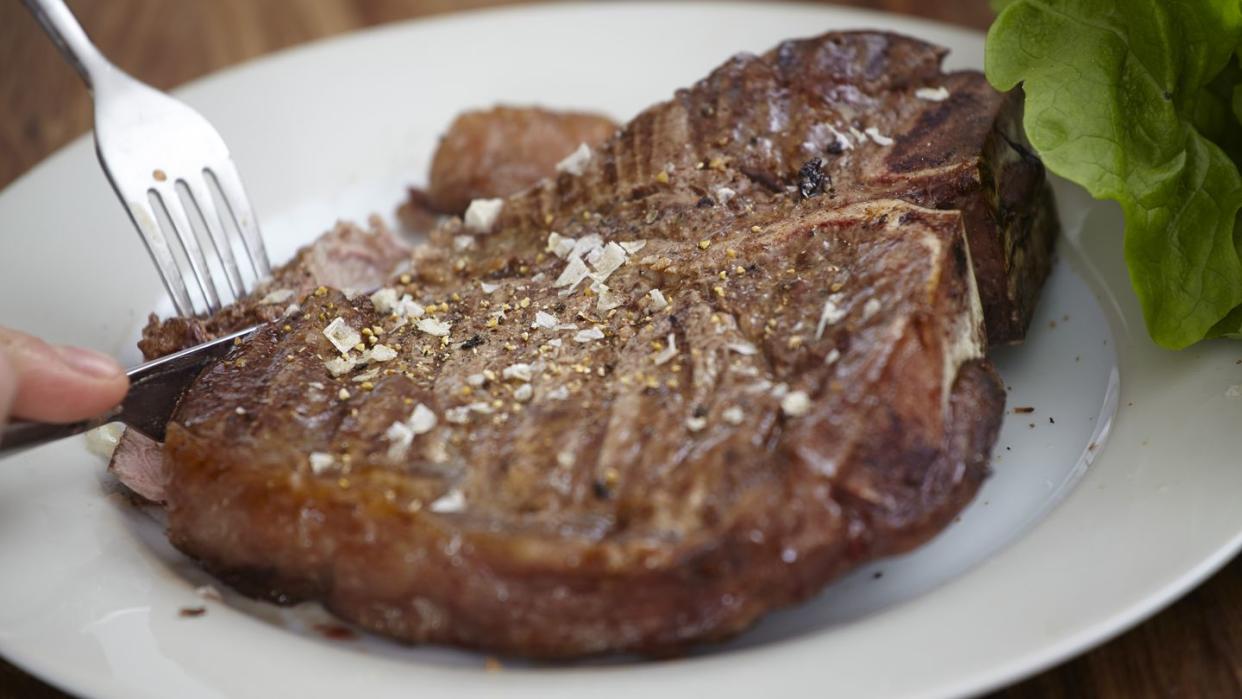 large steak on plate
