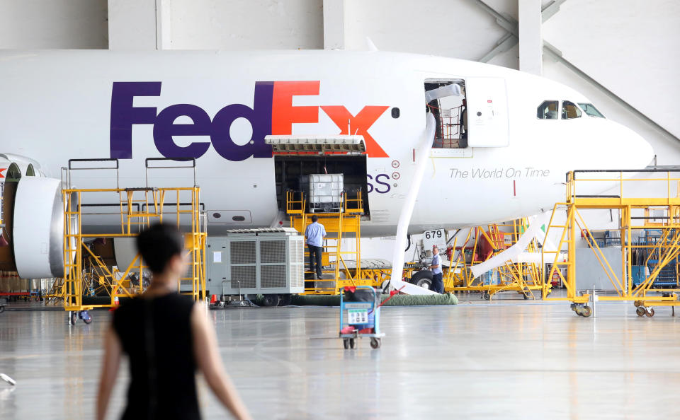 A FedEx Express plane is seen at a maintenance base of Guangzhou Aircraft Maintenance Engineering Company Limited (GAMECO) at the airport in Guangzhou, Guangdong province, China August 16, 2018. Picture taken August 16, 2018.  Feng Zhoufeng/Southern Metropolis Daily via REUTERS ATTENTION EDITORS - THIS IMAGE WAS PROVIDED BY A THIRD PARTY. CHINA OUT.