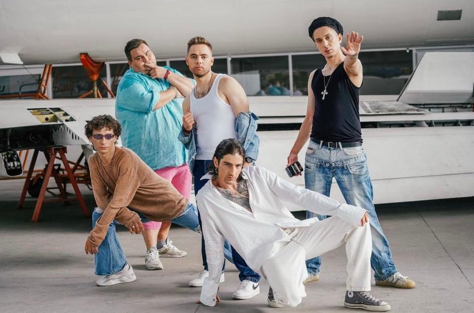 Ukrainian comedians (Right top) Slava Kedr, Anton Tymoshenko, Oleh Swish, and (Left bottom) Vasyl Baydak and singer Volodymyr Dantes pose for a photograph while filming the cover version of the U.S. pop band Backstreet Boys' "I Want It That Way" as part of their campaign to raise money for the Ukrainian military. (Courtesy of Badstreet Boys Fan/Instagram)