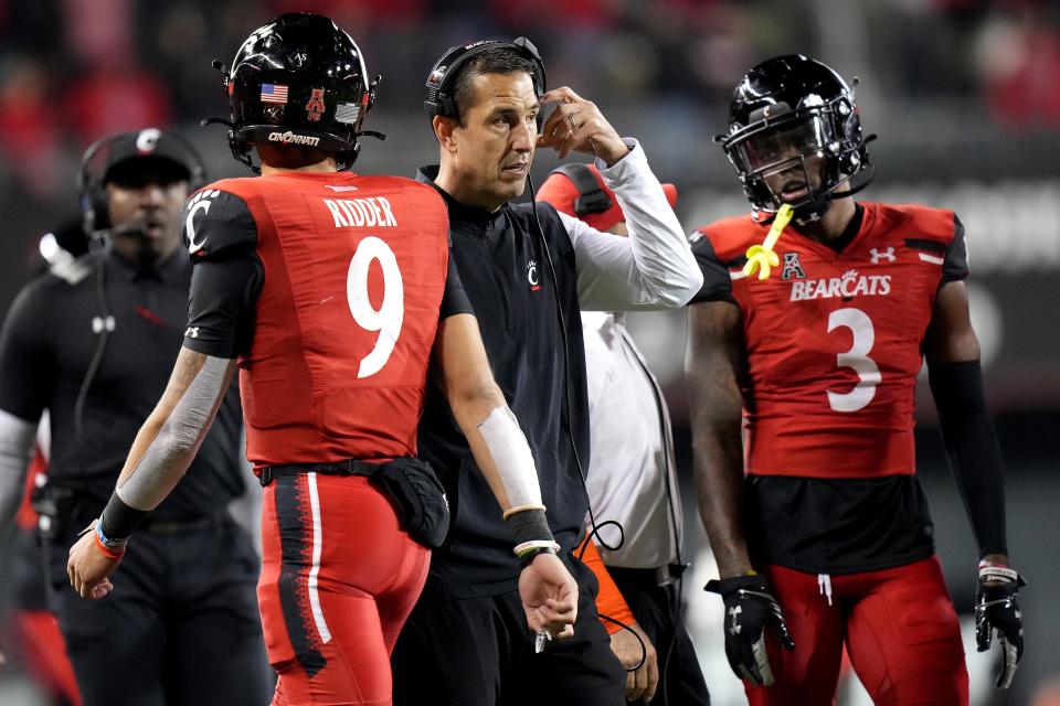 Cincinnati Bearcats head coach Luke Fickell looks onto the field after Cincinnati Bearcats quarterback Desmond Ridder (9), left, fumbled in the fourth quarter during an NCAA football game against the Tulsa Golden Hurricane, Saturday, Nov. 6, 2021, at Nippert Stadium in Cincinnati. The Cincinnati Bearcats won, 28-20. 