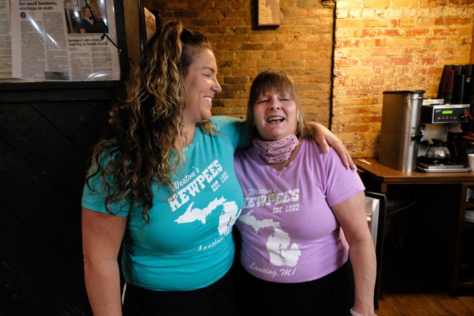 Autumn Weston, left, owner of Weston's Kewpee Sandwich Shoppe in downtown Lansing, gives a hug to Tammie Bunker on Saturday, May 16, 2020.