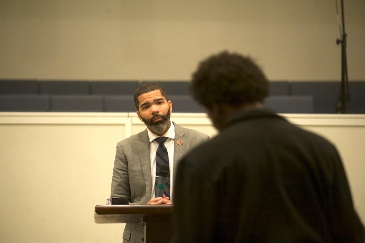 Jackson Mayor Chokwe Antar Lumumba listens to a residents' question at a Tuesday town hall at Reedemer Church.