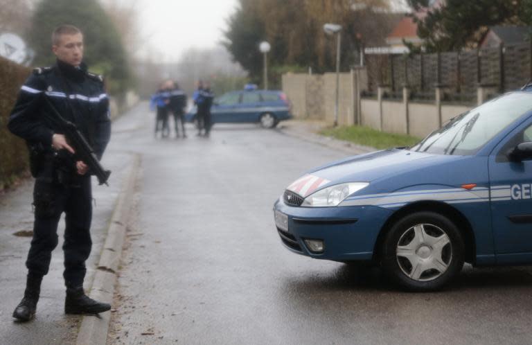French police and gendarmes patrol in Dammartin-en-Goele where a hostage-taking is under way