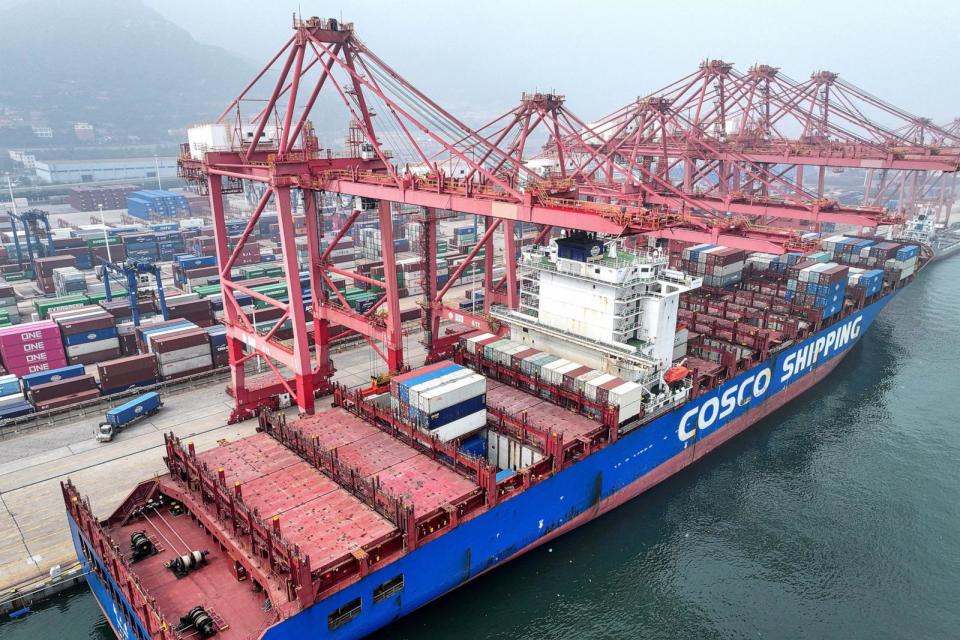 PHOTO: In this file photo taken on July 12, 2024, a cargo ship loaded with containers docks at a port in Lianyungang, east China's Jiangsu Province. (Str/AFP via Getty Images, FILE)