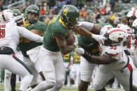 Baylor running back Abram Smith scores a touchdown past Texas Tech defensive lineman Jaylon Hutchings in the first half of an NCAA college football game Saturday, Nov. 27, 2021, in Waco, Texas. (AP Photo/Jerry Larson)