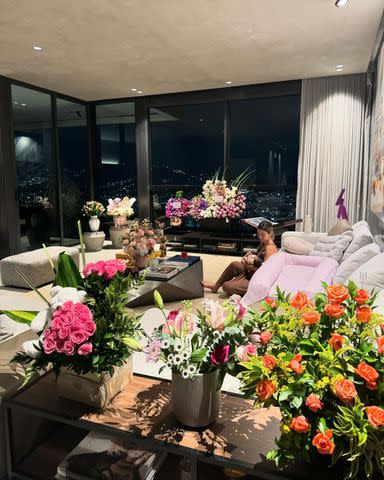 <p>Maluma/Instagram</p> Maluma's girlfriend Susana Gomez cradling their baby girl at home