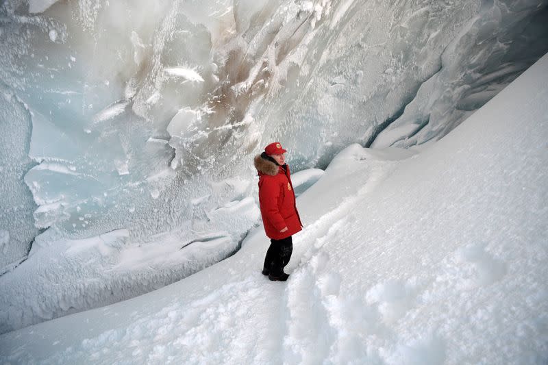 FILE PHOTO: Russian President Putin visits cave of Arctic Pilots Glacier in Alexandra Land in remote Arctic islands of Franz Josef Land