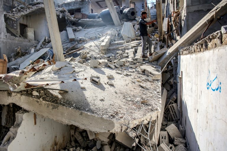 A man stands in the rubble of the house of the sister of Ismail Haniyeh, the Doha-based political bureau chief of the Palestinian Islamist movement Hamas, after it was hit by a strike on June 25, 2024 (Omar AL-QATTAA)