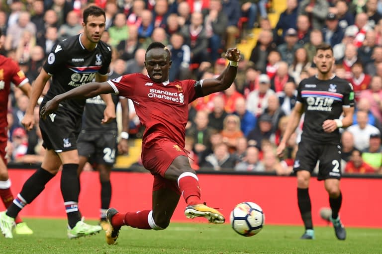 Liverpool's midfielder Sadio Mane shoots to score the opening goal of the English Premier League football match against Crystal Palace August 19, 2017