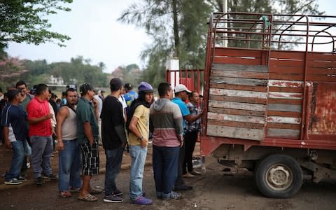 Central American migrants traveling with the annual "Stations of the Cross" caravan  - Credit: AP Photo/Felix Marquez