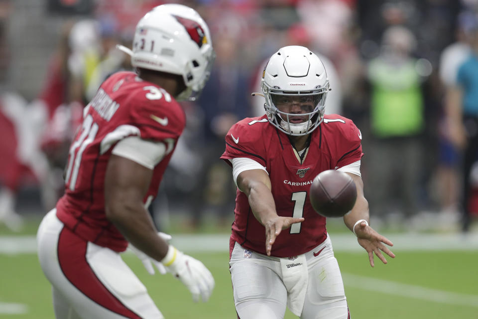 Arizona Cardinals quarterback Kyler Murray (1) hands off to running back David Johnson during the first half of an NFL football game, Sunday, Sept. 8, 2019, in Glendale, Ariz. (AP Photo/Darryl Webb)