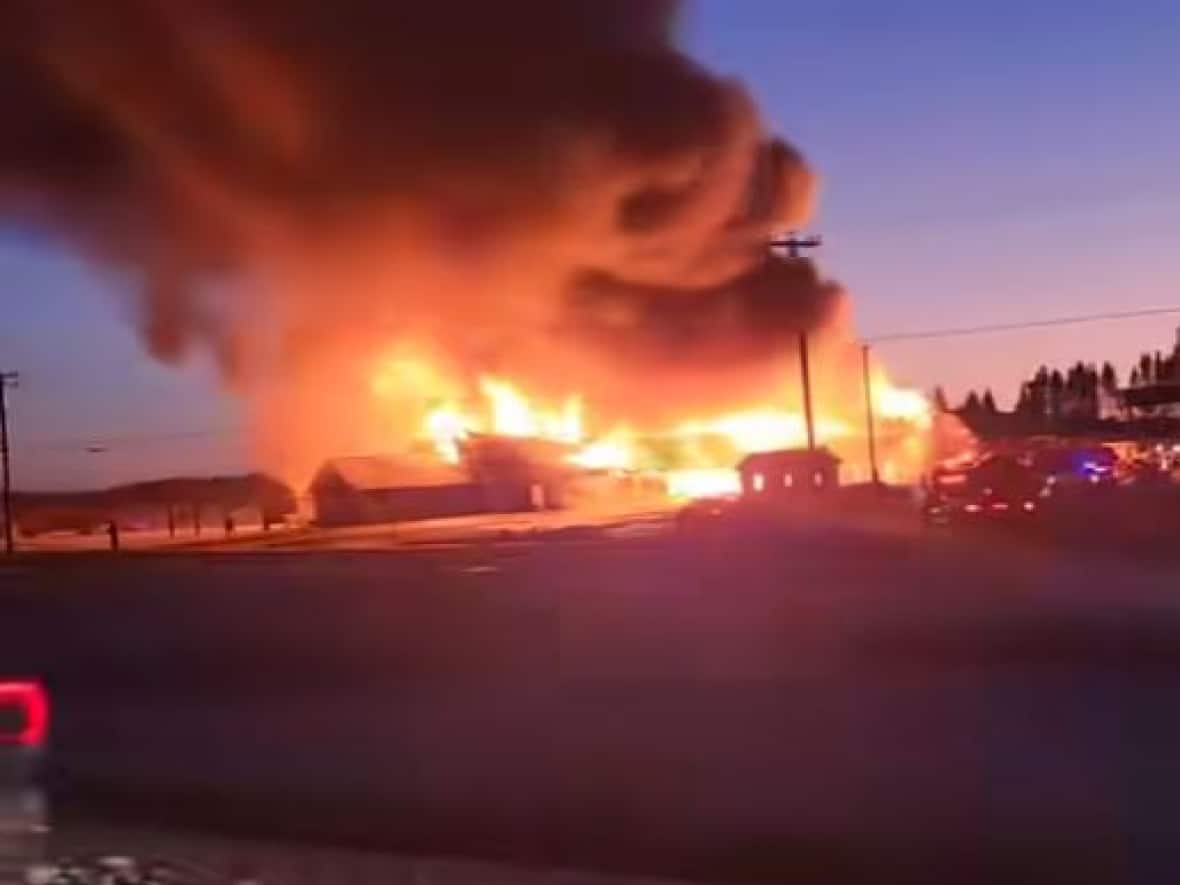 Fire tore through the Covered Bridge Potato Chip Factory in Hartland on Friday evening. Nobody was hurt but onlookers say there's nothing left of the facility. (Submitted by Amy Crawford - image credit)