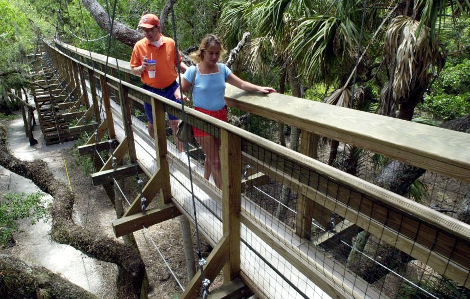 Visitors to the Myakka River State Park in Sarasota cross the canopy bride over the park. The bridge leads to a 400-foot tower that provides a bird’s-eye view of the park.