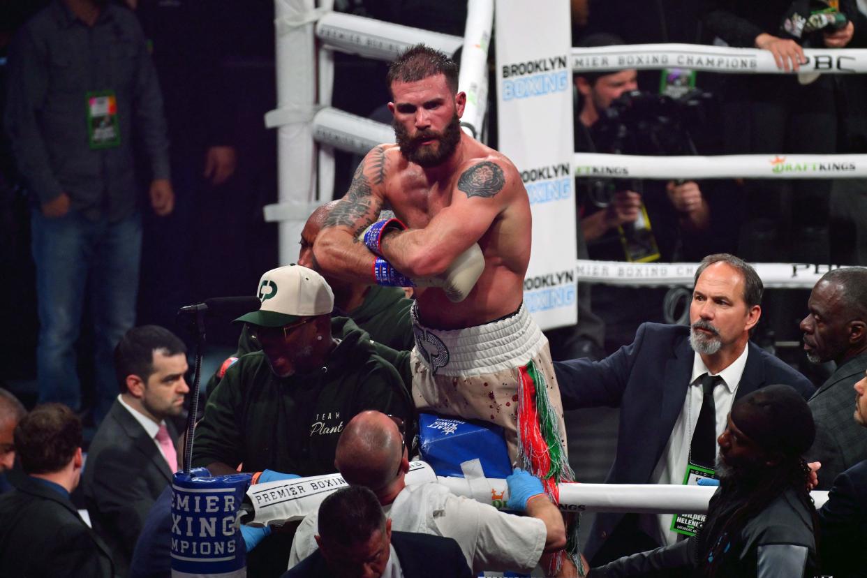 US boxer Caleb Plant (C) celebrates after knocking out US boxer Anthony Dirrell  during their 12-round WBC World Super Middleweight title fight Eliminator fight at Barclays Center in Brooklyn, New York, on October 15, 2022. (Photo by ANGELA WEISS / AFP) (Photo by ANGELA WEISS/AFP via Getty Images)