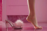 <p>While everyone is focused on <a href="https://people.com/movies/chrissy-teigen-marvels-barbie-trailer-shot-of-foot-leaving-shoe/" rel="nofollow noopener" target="_blank" data-ylk="slk:Robbie's arched feet in the trailer;elm:context_link;itc:0;sec:content-canvas" class="link ">Robbie's arched feet in the trailer</a>, we're obsessing over her fluffy heels, which are covered in rhinestones. Anyone else getting <em>Legally Blonde</em> flashbacks? </p>