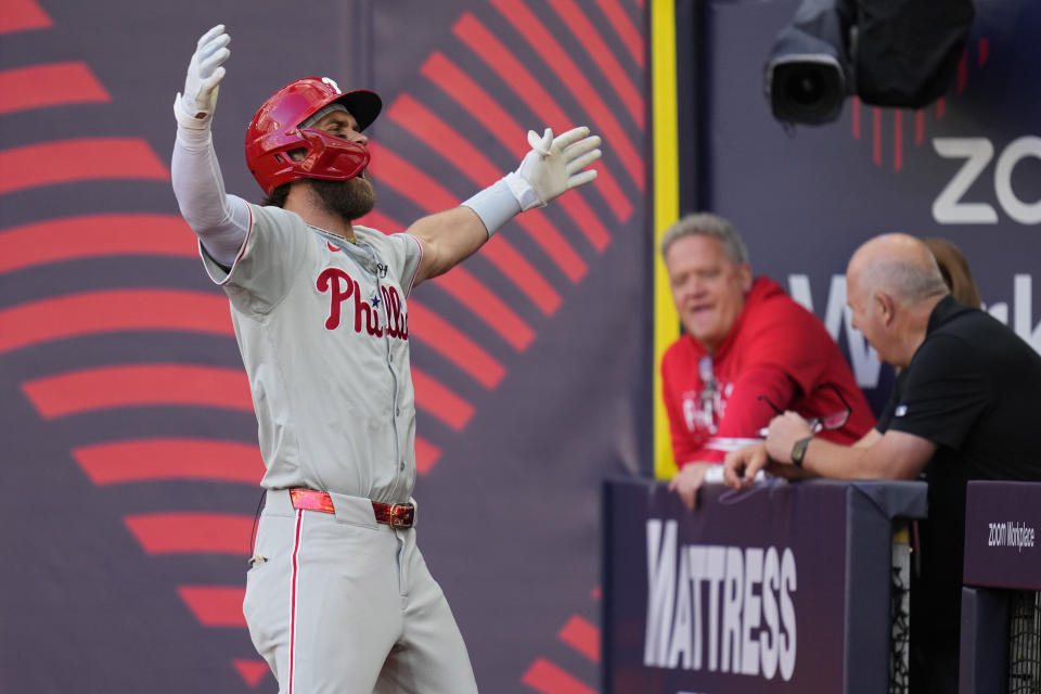 Philadelphia Phillies' Bryce Harper (3) celebrates after hitting a home run against the New York Mets during the fourth inning of a London Series baseball game in London, Saturday, June 8, 2024. (AP Photo/Kirsty Wigglesworth)