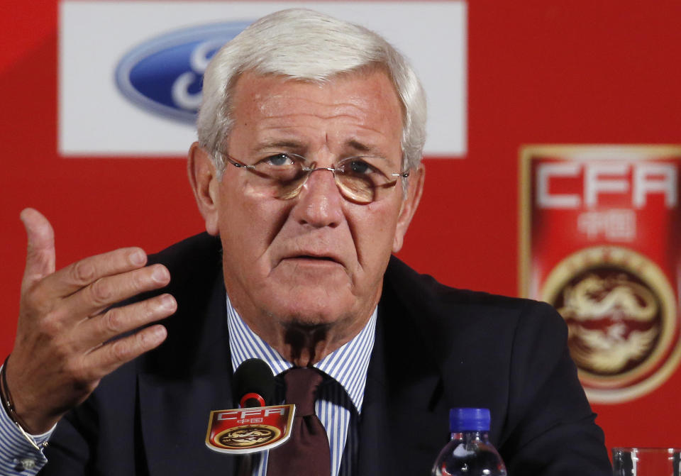 FILE - In this Oct. 28, 2016, file photo, China's national football team coach Marcello Lippi speaks during a news conference at a hotel in Beijing. Soccer’s two biggest sleeping giants India and China meet in Suzhou, China on Saturday, Oct. 13, 2018, for the first time since 1997. Representing around one-third of the world’s population, India and China both show signs of growing strength in their domestic leagues, despite limited international success. (AP Photo/Andy Wong, File)