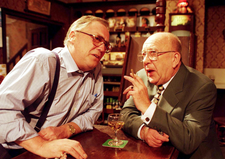 Jack Duckworth [William Tarmey] and Alec Gilroy [Roy Barraclough] chat over the bar in the Rovers in 1997 (Rex)