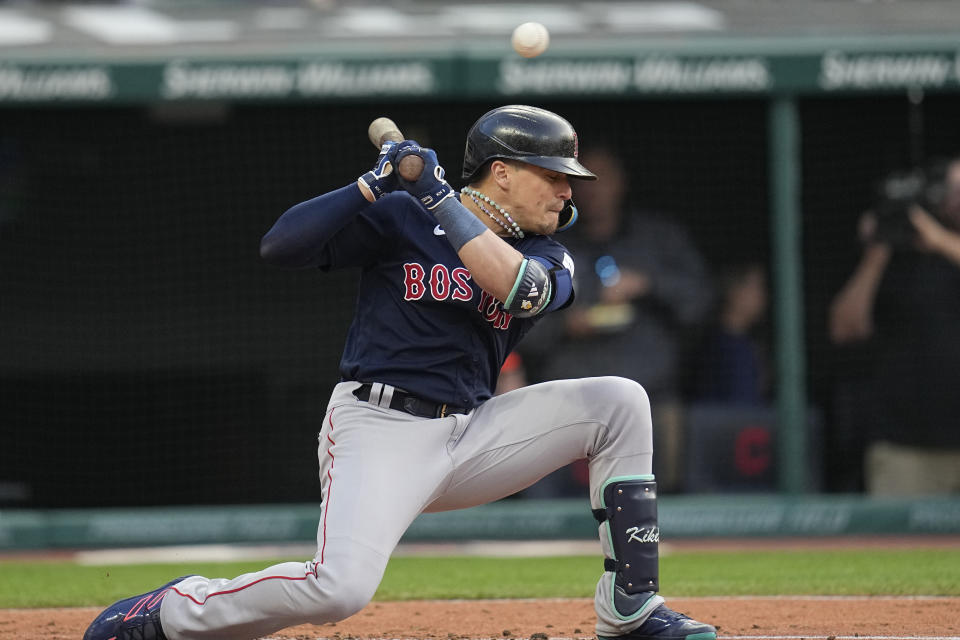 Boston Red Sox's Enrique Hernandez dunks away from a low pitch in the fourth inning of the team's baseball game against the Cleveland Guardians, Wednesday, June 7, 2023, in Cleveland. (AP Photo/Sue Ogrocki)
