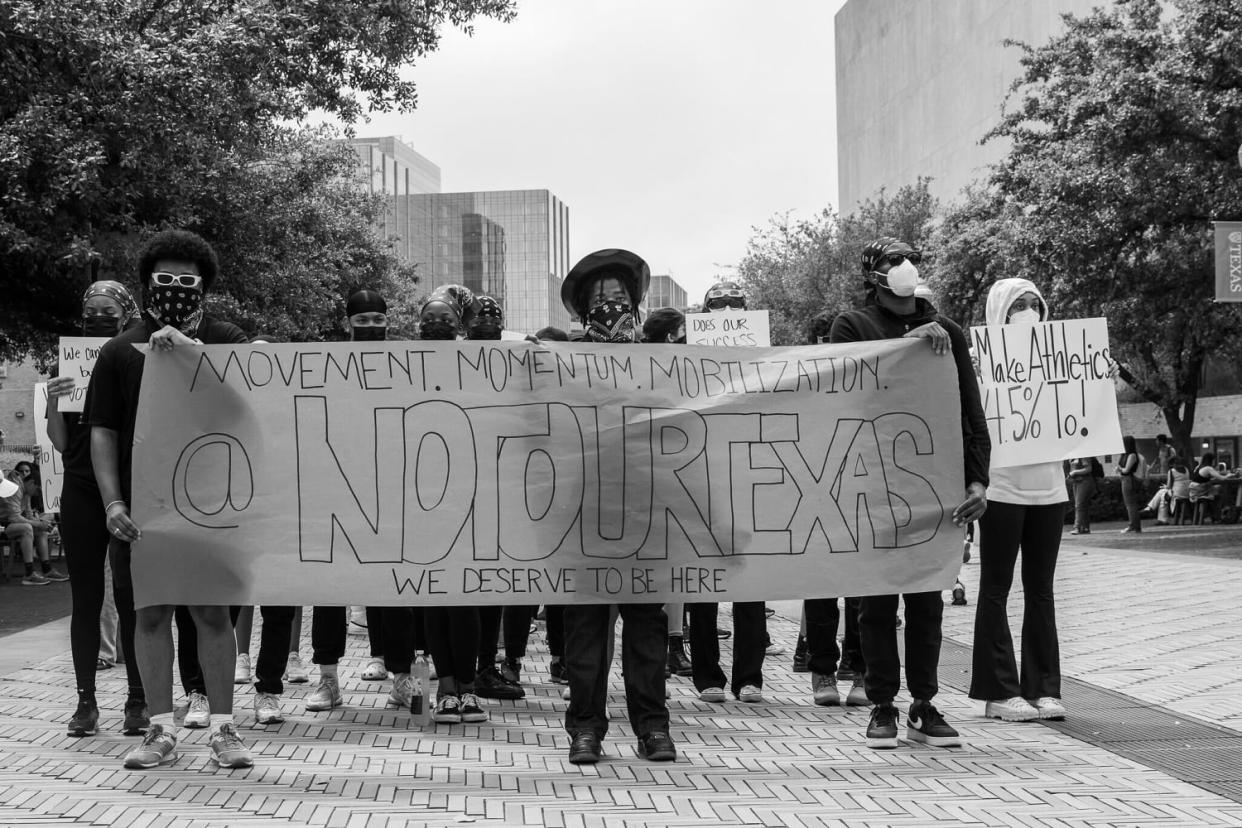 Students protest the layoffs of employees in DEI-related positions at the University of Texas at Austin on Monday, April 15, 2024. (Madison Morris)