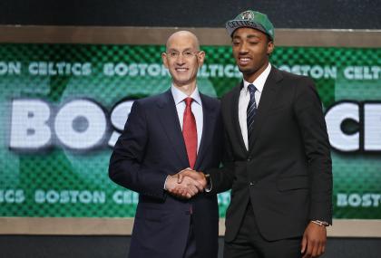 James Young poses with NBA Commissioner Adam Silver. (AP)