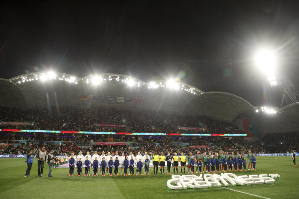 Germany, left, and Morocco players lineup before the Women's World Cup Group H soccer match between Germany and Morocco in Melbourne, Australia, Monday, July 24, 2023. (AP Photo/Hamish Blair)