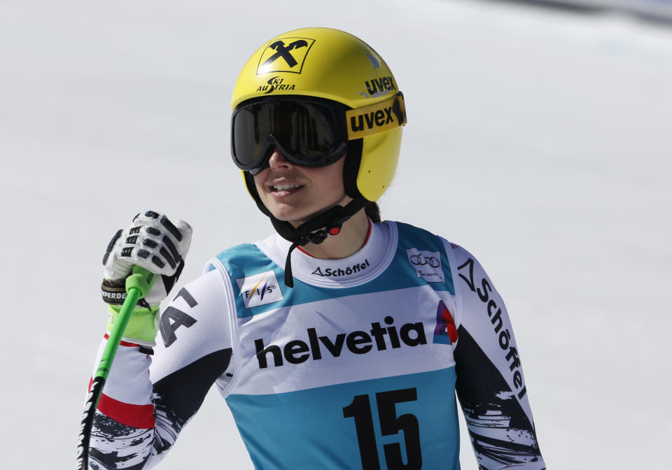 Austria's Anna Fenninger celebrates at finish line after taking second place in a women's alpine skiing Super-G at the World Cup finals in Lenzerheide, Switzerland, Thursday, March 13, 2014. (AP Photo/Marco Trovati)