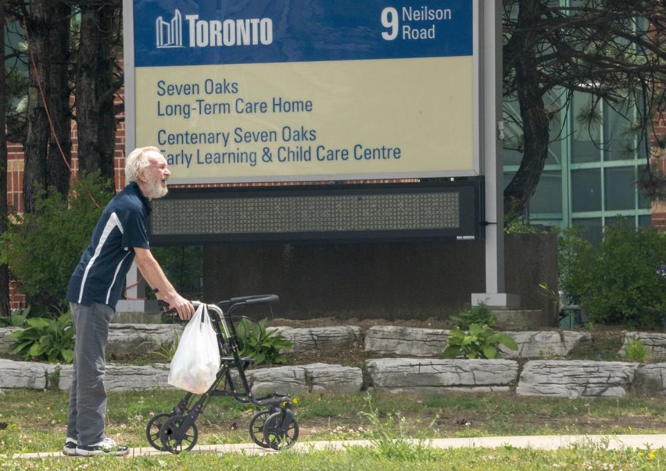 <span class="caption">A man takes a walk outside the not-for-profit Seven Oaks Long-Term Care Home in Toronto in June 2020.</span> <span class="attribution"><span class="source">THE CANADIAN PRESS/Frank Gunn</span></span>