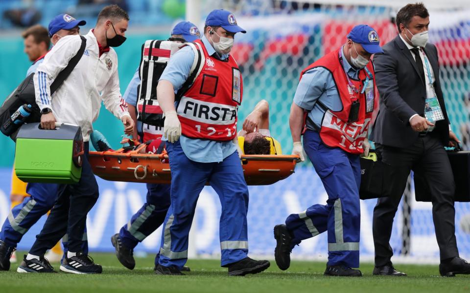 Russia defender Mario Fernandes was taken to the hospital with a suspected spinal injury - GETTY IMAGES