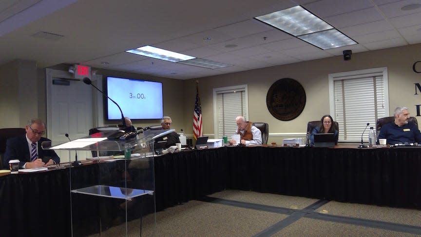 Mount Dora City Manager Patrick Comiskey, far left, was suspended on Monday by the city council.