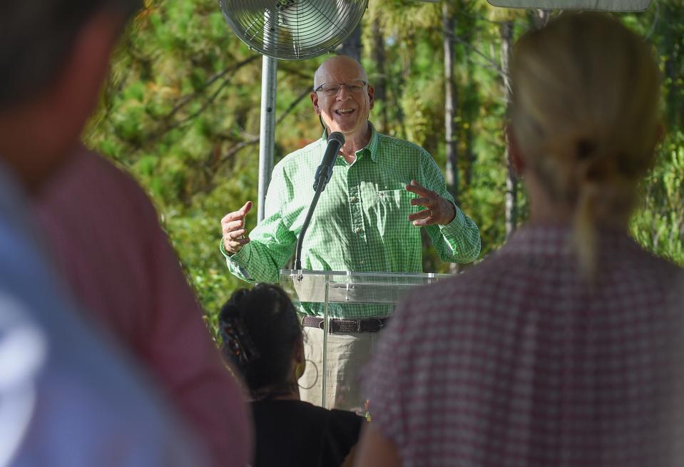 Former economic journalist Knight Kiplinger speaks to the crowd attending the unveiling of the plaque commemorating the initial trailhead at the Trails at Kiplinger Conservancy (KC Trails) located along S.W. Citrus Blvd. on Wednesday, July 19, 2023, in northern Martin County. KC Trails will be a part of Mattamy Homes’ Newfield development off S.W. Citrus Blvd. "We're fulfilling a pledge I made to the people of Martin County six years ago as I began to describe a very unusual new community called Newfield," Kiplinger said earlier. "I said it would have a unique sat-aside [area] of acreage as open space and natural land accessible to everybody, twice the size of Martin County’s largest park today, Halpatiokee.